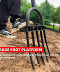 Heavy Duty Garden Fork With Five Diamond Point Tines, 45 Inch Long Hand Tiller in use on soil with slip foot plate visible