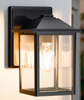 Heavy Duty Outdoor Wall Light Built Sick For Rain Or Shine Premium Metal Sconce With Shatter Proof Glass in black finish.
