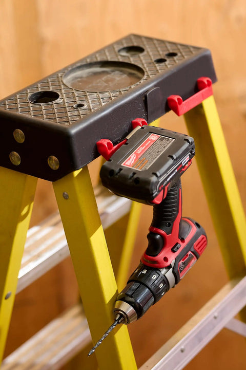 Rugged Tape Measure Holder For Garage Organization, Keeps Tools Handy On Ladder Or Workbench, Grab-And-Go Quick Install Tool Hook Pack Of 4, Built To Last, Versatile, Yellow attached to ladder with drill hung on it
