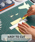 Box cutter knife, 4-pack retractable utility knives with yellow handles on a cutting mat.