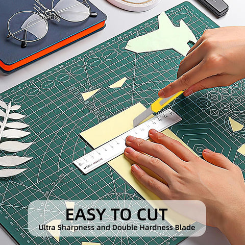 Box cutter knife, 4-pack retractable utility knives with yellow handles on a cutting mat.