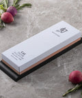 Dual Sided Knife Sharpening Whetstone With Ceramic Grit 300 And 1000 For Honing Edges, 6 Inch DM0708, on a kitchen counter