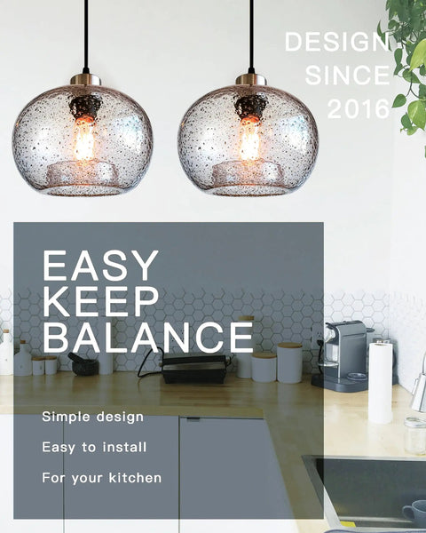 Cool Blue Bubble Glass Pendant Light for kitchen island with brushed nickel finish in modern kitchen setting, 9 inch diameter.