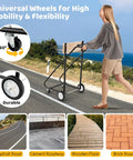 Person pushing Built Tough Heavy Duty Outboard Boat Motor Stand with 330 lbs capacity on asphalt road, showing 4 casters