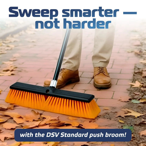 Person using Heavy Duty Workhorse 18 Inch Push Broom With Extended Handle And Tough Six Row Bristles on outdoor patio.
