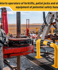 Beefy Heavy Duty Steel Machine Guard Barrier near factory machinery, 36x24 inches, yellow with black stripe, 4.5 inch OD posts.