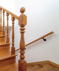 Heavy Duty Handrail Brackets For Stairs 3 Inch Black Metal Wall Mount supports on wooden staircase with railing.