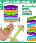 Science Party Favor Bundle With Drawstring Bags, Silicone Bracelets, Pins And Stickers, 86 Piece Scientist Birthday Decor Set includes colorful silicone bracelets with 'Science is Awesome' text.