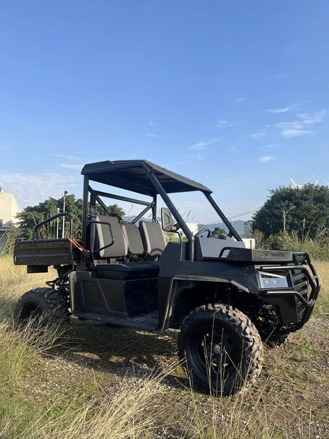 Side view of rugged 1000cc off-road UTV in grass for construction and farm work, heavy duty utility vehicle for agriculture.