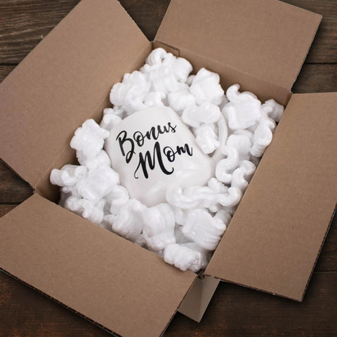 Heavy Duty White Packing Peanuts For Zero Stress Shipping Anti Static S Curve Half Cubic Foot Void Fill keeping fragile mug secure in carton.