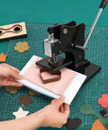 1.5 Ton Leather Die Cutting Machine With 12x9cm Leather Hand Press And Adjustable Pressure Stroke Includes 39 Piece Punch Tool Set For Leathercraft Diy Projects And Cutting Various Materials visible in use with leather.