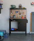 Boss Level Multipurpose Workbench With Lockable Storage Cabinet And Slide Drawer in garage setting with tools on pegboard