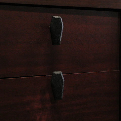 Gothic Black Cast Iron Coffin Drawer Pulls, 6-Piece Set, installed on dark wooden drawers, each 2.5 inches long and 1.5 inches high.