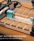 Rotary Module Kit For Prover XL 4030 V2 CNC Router with NEMA23 stepper motor and 4 jaw chuck on a wooden base.