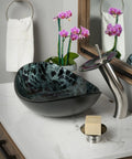 Bathroom setting with Oval Glass Vessel Sink Hand Painted Sleek Dope Look With Black And Silver Tempered Glass Above Counter Install