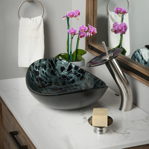 Bathroom setting with Oval Glass Vessel Sink Hand Painted Sleek Dope Look With Black And Silver Tempered Glass Above Counter Install