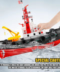 RC Fire Rescue Boat With 2 4GHz Remote Water Spray Function Dual Rechargeable Batteries in water, hand stabilizing for pool or lake.