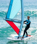 Person windsurfing on a blue inflatable kite surfing sail and wing foil board set with pump, dope 3.2 square meters PVC wing