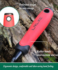 Close-up of a red non-slip rubber handle from a heavy duty stainless steel garden trowel on rocky dirt