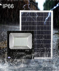 Top Tier Solar Led Flood Light With Remote Trigger And Smart Motion Detector For Driveway And Fence, Super Bright Ip66 Weather Proof Outdoor Security Lamp That Slaps next to solar panel in rain.