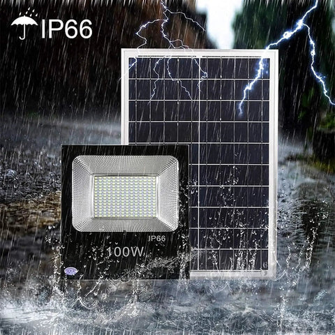 Top Tier Solar Led Flood Light With Remote Trigger And Smart Motion Detector For Driveway And Fence, Super Bright Ip66 Weather Proof Outdoor Security Lamp That Slaps next to solar panel in rain.