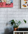Room with Peel And Stick 3D Foam Faux Brick Wall Panels White, Waterproof Self Adhesive Brick Wallpaper and decor items.