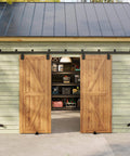Outdoor Ready 12 Foot Exterior Sliding Barn Door Hardware Kit Box Rail Track For Outdoor Use Beefy Built To Last Heavy Duty Wall Mount System Supports Up To 450 Pounds Fits Double 36 Inch Doors Galvanized Coated For Weather Tough Performance on a wooden shed