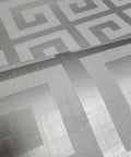 Modern Geometric Greek Key Wallpaper With Metallic Matte Finish Premium Washable Removable Wall Covering For Accent Walls Bathrooms And Basements Double Roll close-up of gray silver pattern
