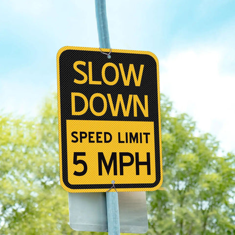 6 Pack Bright Yellow Slow Down 5 MPH Speed Limit Signs Durable Reflective Aluminum Street Safety Boards No Sweat Setup For Driveways Parking Lots And Rental Properties, close-up of reflective sign