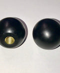 Two black phenolic ABS ball knobs with brass threaded insert; 3/8-16 female thread.