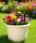 Drip irrigation stake supporting tubing in a flower pot, part of 100 Pieces Drip Irrigation Stakes For 1/4 Inch Tubing, 5.68 Inch Long Plastic Stakes