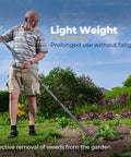 Person using Extra Wide 17 Inch Double Sided Garden Rake in garden, showing light weight and effective debris removal.