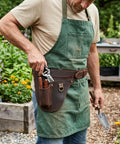 Gardener wearing Genuine Leather Florist Tool Belt Gardening Bag For Gardeners And DIY Pros With 3 Pockets Waist Pouch Holster Brown Leather 42 Inches Belt For Gardening Farm And Workshop Use.