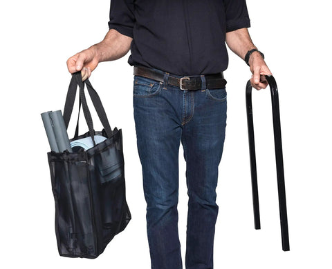 Man holding a black bag with cleaning tools and a metal handle, featuring Heavy Duty Commercial Steam Cleaner Kickin Out Stubborn Grime With Chemical Free Power And Thick Stainless Boiler Plus Fifty Pro Nozzles For Top Shelf Cleaning Hustle.