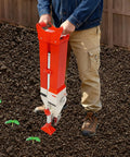 Person using Easy To Use Manual Vegetable Seeder And Fertilizer Tool in garden for sowing and feeding corn, peanut seeds, no electricity