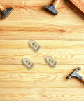 Self Drilling Drywall Anchors Kit 40 Pieces Carbon Steel Wall Anchors Heavy Duty No Drill Fasteners For Quick Mounts Of Shelves Frames TVs And More On Drywall, assorted anchors on wood background