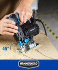 Hammerhead HAJS048 corded jig saw cutting plywood; black with blue accents.