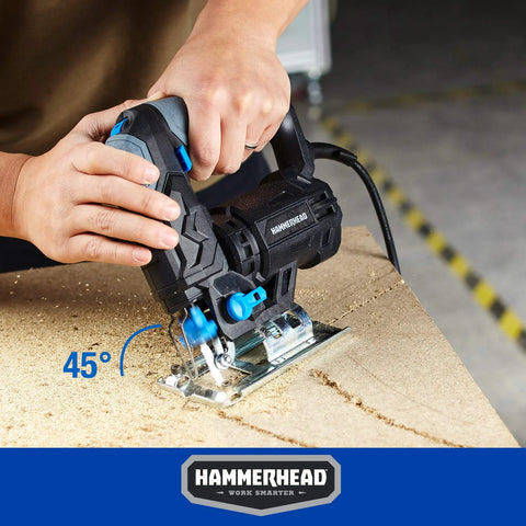 Hammerhead HAJS048 corded jig saw cutting plywood; black with blue accents.