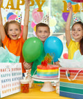 Birthday Gift Bags Set Of 2 Large 16 Inch Gift Bags With Handles Includes Matching Tissue Paper Cards And Stickers Reusable And Easy Gift Wrapping For Any Occasion Like Birthdays Weddings Mother's Day And More, as kids celebrate around a colorful birthday table.
