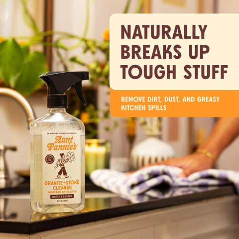 Granite And Stone Daily Countertop Cleaner With Plant Based Formula for various surfaces, bottle on kitchen counter.