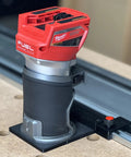 Solid As A Rock Guide Rail Adapter Plugs Right Into Milwaukee Router, showing Router mounted on track for precise cuts.