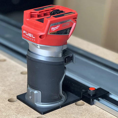 Solid As A Rock Guide Rail Adapter Plugs Right Into Milwaukee Router, showing Router mounted on track for precise cuts.