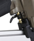 Close-up of 21 Degree Full Round Head Framing Nailer With Tool Free Depth Adjustment trigger and rubber grip