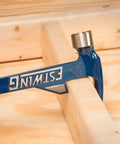 Hammertooth Style Hammer 24 Oz With Long Handle Rip Claw Smooth Face Shock Reduction Grip in use on wood piece