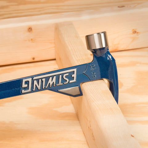 Hammertooth Style Hammer 24 Oz With Long Handle Rip Claw Smooth Face Shock Reduction Grip in use on wood piece