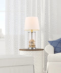 Maya 21 Inch Fillable Table Lamp With Clear Glass Base And White Linen Shade in living room setting