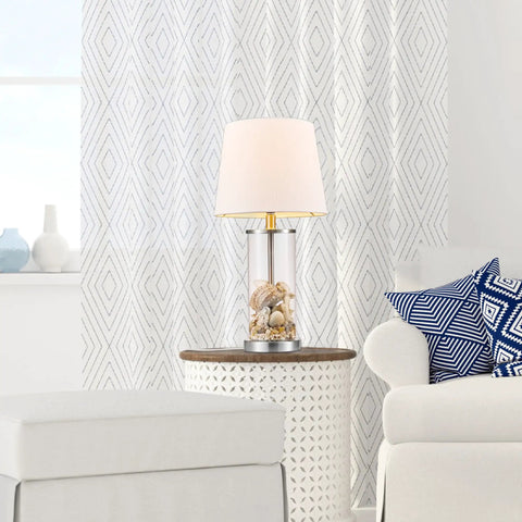 Maya 21 Inch Fillable Table Lamp With Clear Glass Base And White Linen Shade in living room setting