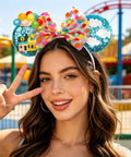 Blue Balloon Hut Sequin Ears Headband With Cloud Confetti Bow And Balloon House Charms Fun Plush Mouse Ear Accessory For Adults And All Your Outings Cute Day Trip Party Wear For All Day Adventures worn by a smiling woman