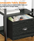 Close-up of the fabric drawer on the 5 Tier Bookshelf With Drawer And Industrial Style Bakers Rack In Black