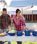 Couple using 1.75 Quart Enamel Camp Pot With Lid And Bail Handle For Outdoor Cooking Camping And Travel, blue speckle finish